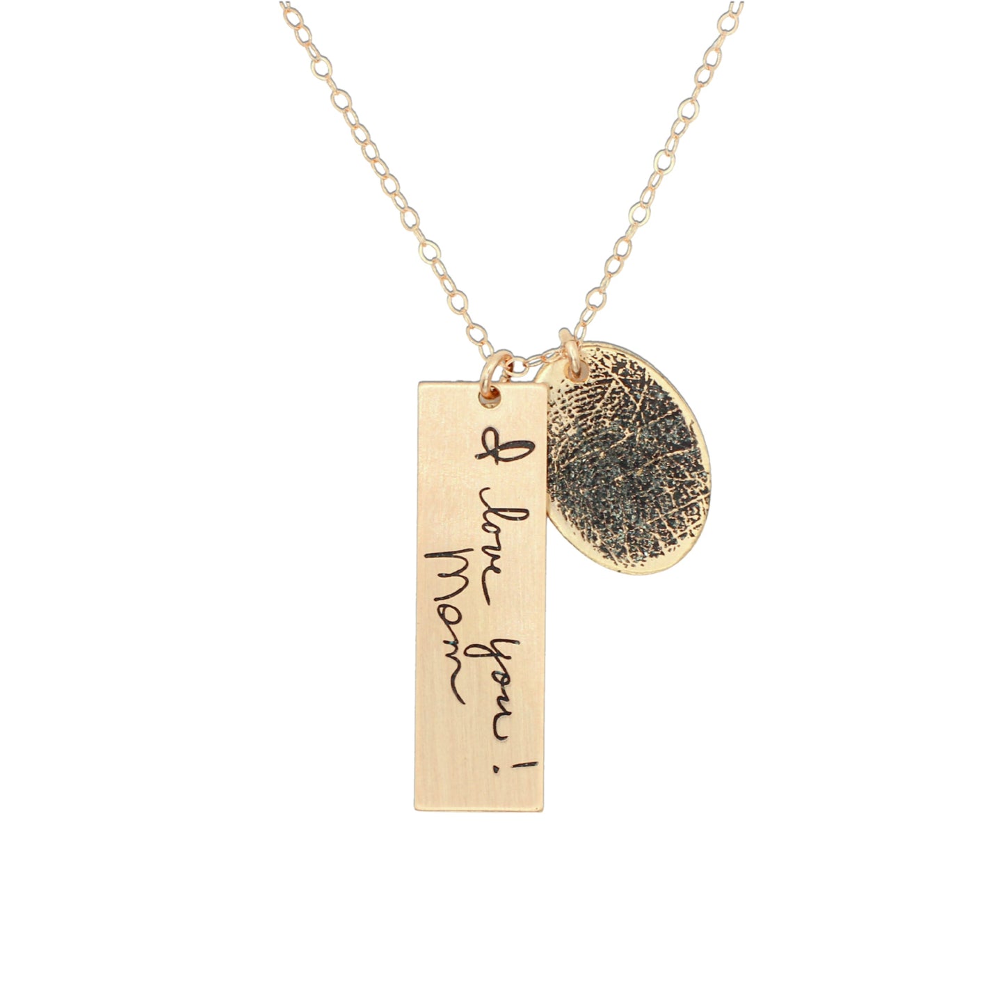 Gold necklace with two pendants on a white background