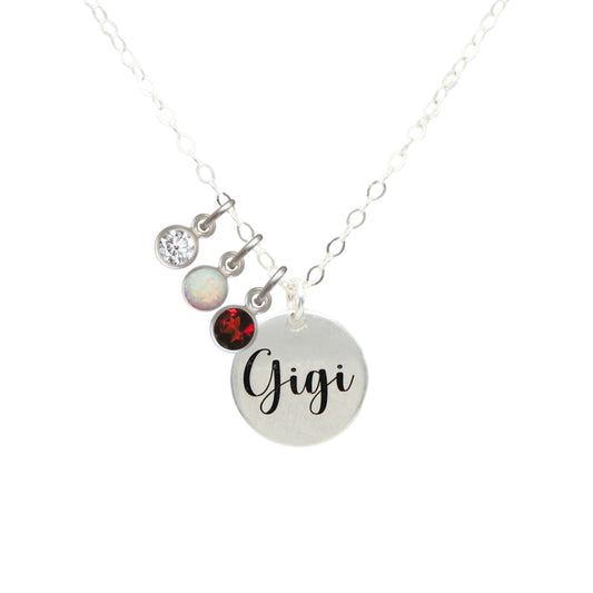 Necklace with a round pendant labeled 'Gigi' on a white background